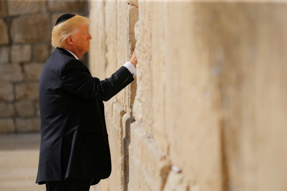 U.S. President Donald Trump places a note in the stones of the Western Wall, Judaism's holiest prayer site, in Jerusalem's Old City