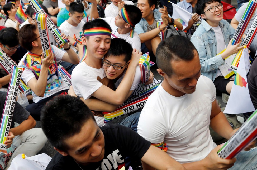Supporters hug each other during a rally after Taiwan's constitutional court ruled that same-sex couples have the right to legally marry, the first such ruling in Asia, in Taipei