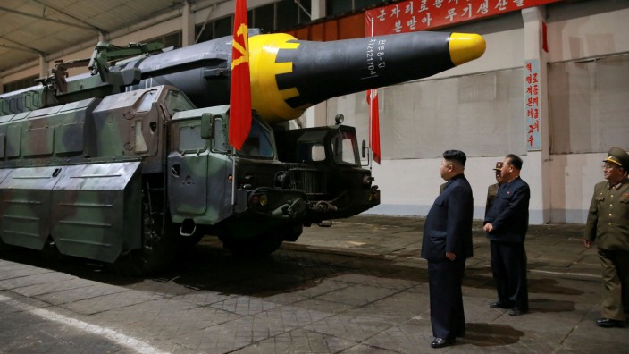North Korean leader Kim Jong Un inspects the long-range strategic ballistic rocket Hwasong-12 (Mars-12)