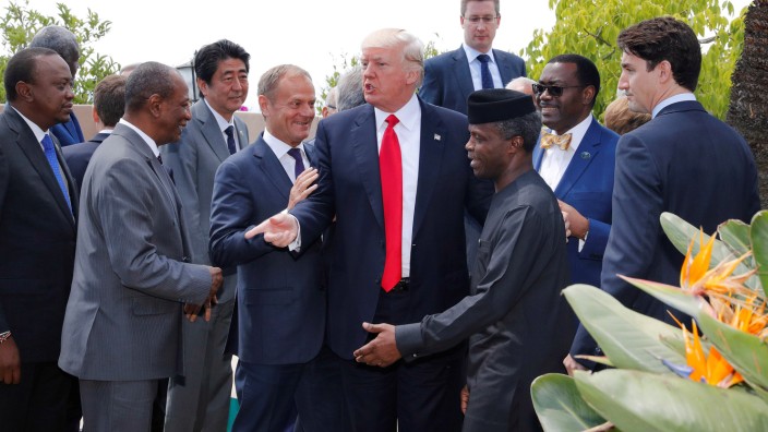 U.S. President Donald Trump poses with African leaders after the family photo at the end of the expanded session at the G7 Summit in Taormina
