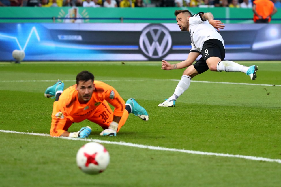 Borussia Dortmund's Roman Burki in action with Eintracht Frankfurt's Haris Seferovic