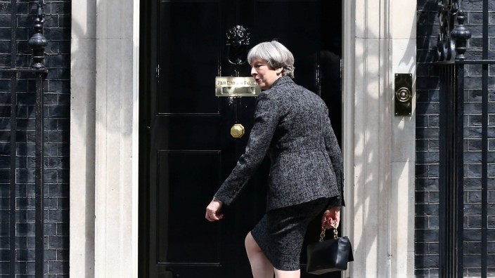 Britain's Prime Minister, Theresa May, arrives at number 10 Downing Street, in London