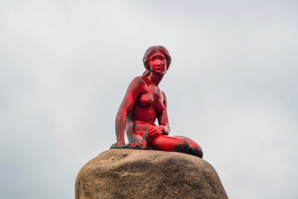 The Little Mermaid statue is seen painted in red in what local authorities say is an act of vandalism, in Copenhagen