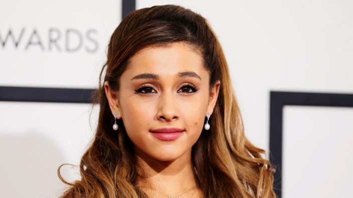 FILE PHOTO: Singer Ariana Grande arrives at the 56th annual Grammy Awards in Los Angeles