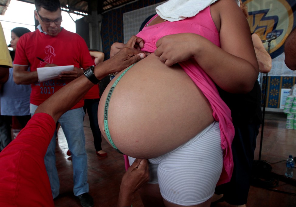 A pregnant woman takes part in an event  to celebrate National Mother's Day in Managua