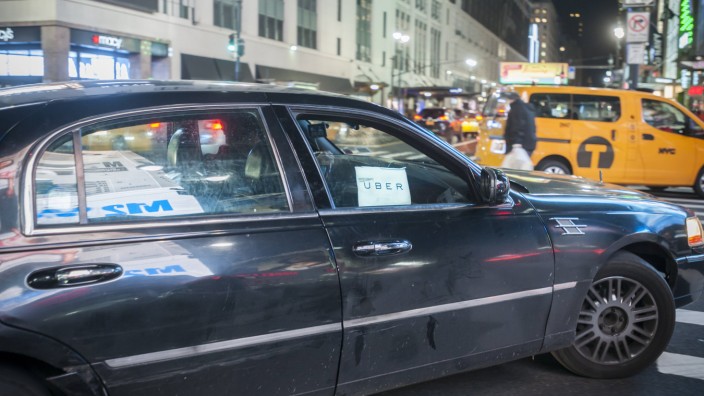 Uber livery car in New York An Uber livery travels through Midtown Manhattan in New York on Tueday