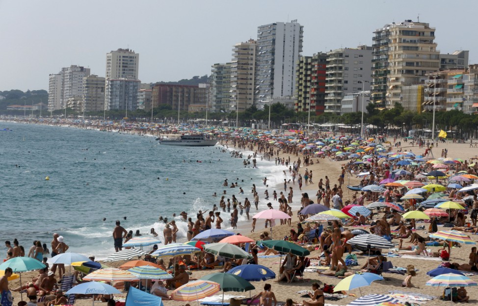 People cool off at platja d'Aro beach in Costa Brava, north of Barcelona