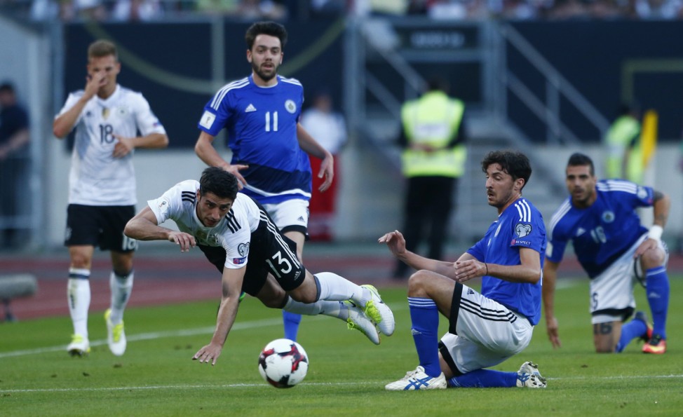 Germany's Lars Stindl in action with San Marino's Michele Cervellini