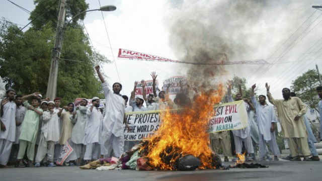 Activists of Jamiat Talaba-e-Arabia chant slogans against Salman Rushdie in Multan