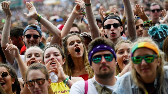 Revellers dance as they listen to Charli XCX perform on the Other Stage at Worthy Farm in Somerset during the Glastonbury Festival