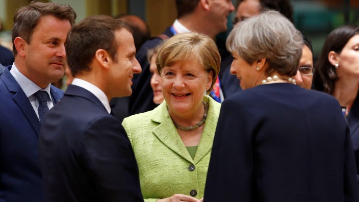 French President Emmanuel Macron, German Chancellor Angela Merkel and British Prime Minister Theresa May attend the EU summit in Brussels