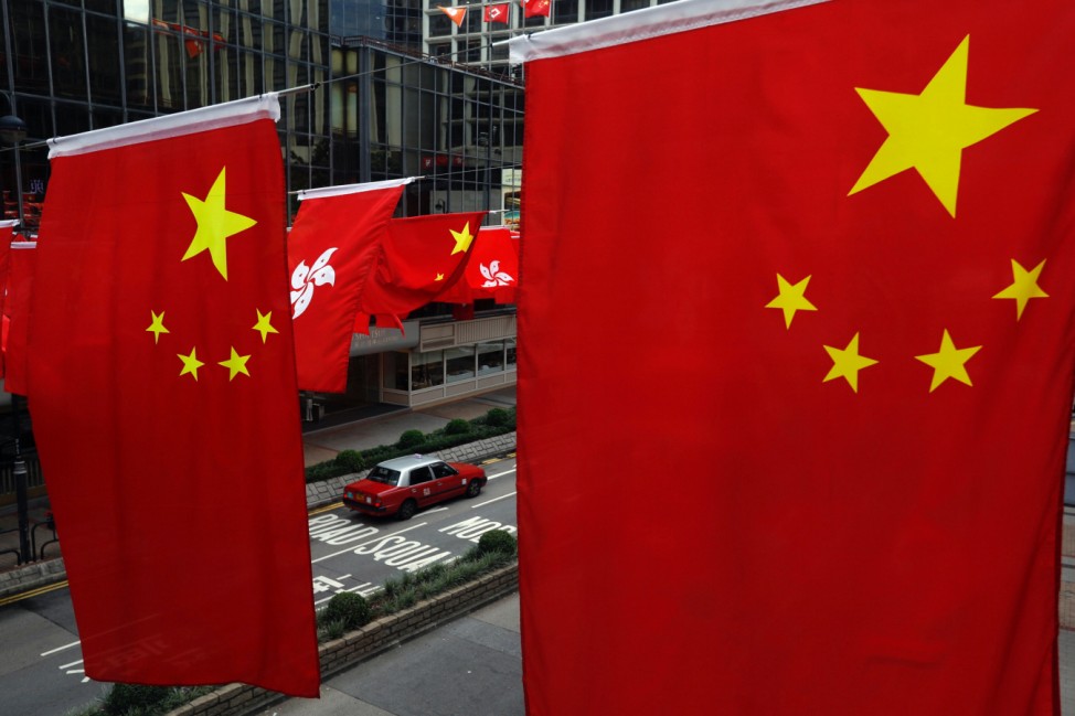 Chinese and Hong Kong flags are seen ahead of 20th anniversary of the handover from Britain to China, in Hong Kong