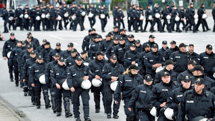 Police forces patrol during a demonstration against a new temporary prison for the G20 Summit in Hamburg