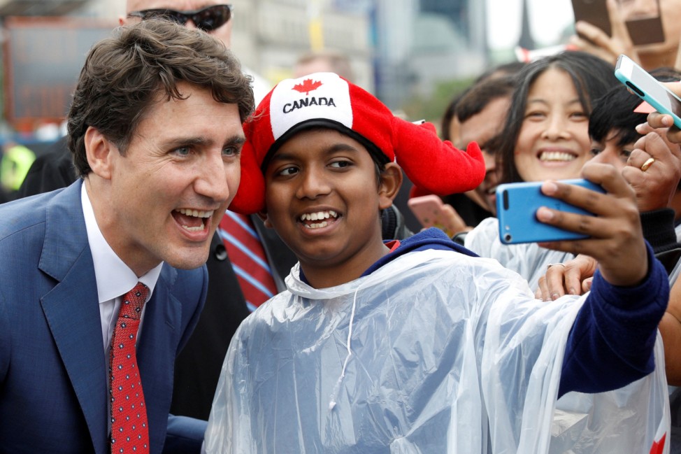 Canada's PM Trudeau poses for a selfie during Canada Day celebrations as the country marks its 150th anniversary since confederation, on Parliament Hill in Ottawa