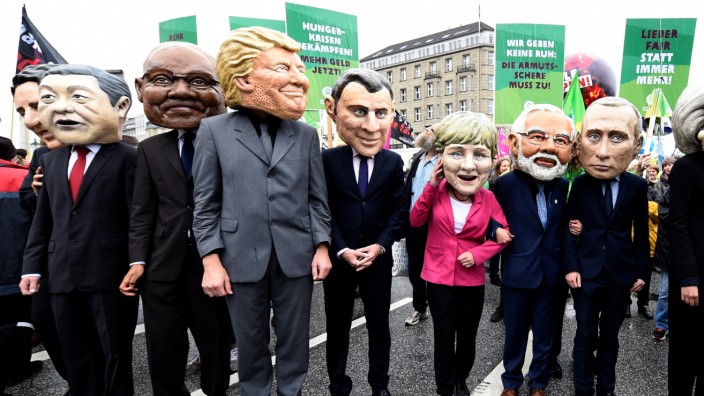 OxfamâÄÖs Big Heads depict G20 leaders take part in protests ahead of the upcoming G20 summit in Hamburg