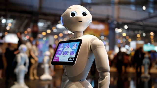 A 'Pepper' humanoid robot, manufactured by SoftBank Group Corp., stands at the Viva Technology conference in Paris