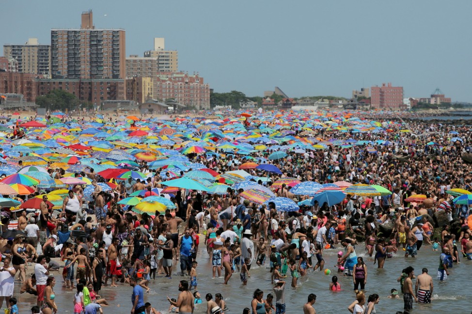 Beachgoers gather at Coney Island Beach on the Independence Day holiday in Brooklyn, New York City