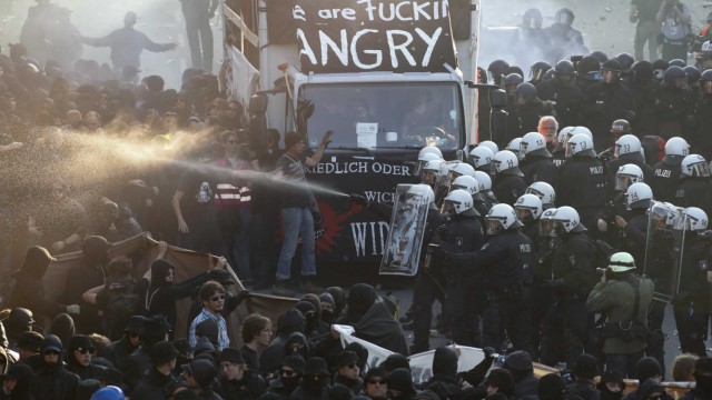 German riot police confront protesters during the demonstrations during the G20 summit in Hamburg