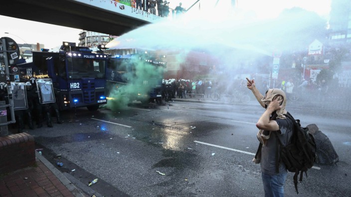 German riot police use water cannons against protesters during the demonstrations during the G20 summit in Hamburg