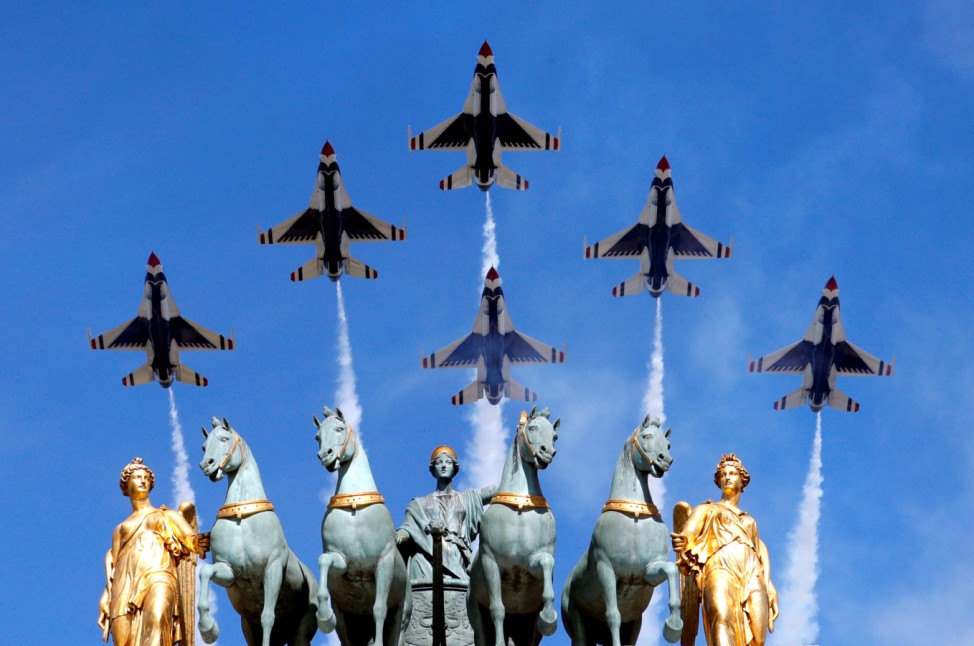 The US Air Force Thunderbirds fly over the Arc de Triomphe du Carrousel during the traditional Bastille Day military parade in Paris