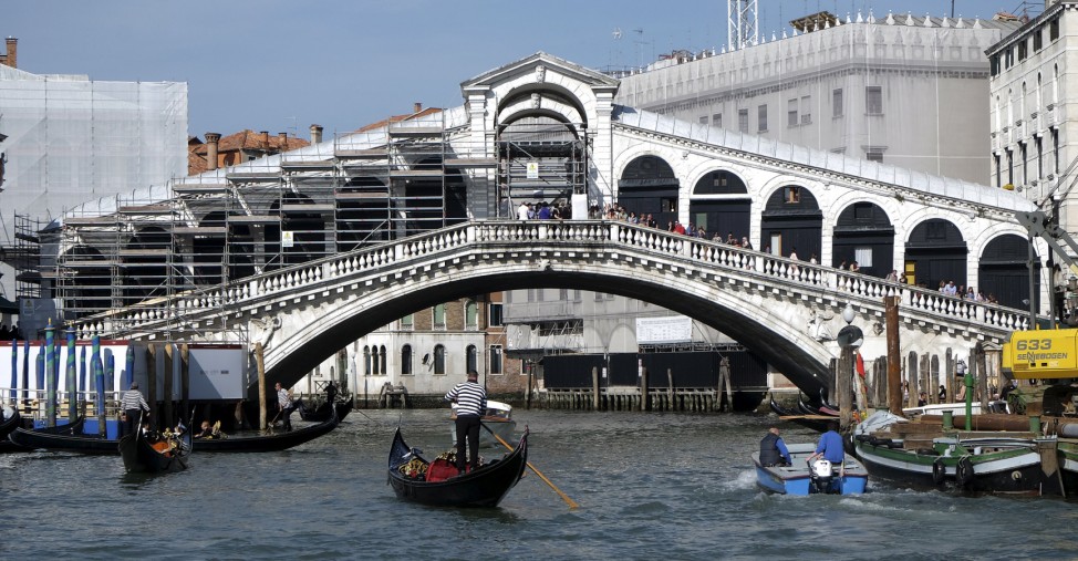Scaffoldings are seen during the restoration of the Rialto Bridge on the Grand Canal in Venice lagoon