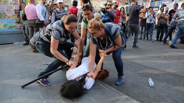 Police officers detain a demonstrator during a protest against the dismissal of civil servants following a post-coup emergency decree, in the Kurdish-dominated southeastern city of Diyarbakir