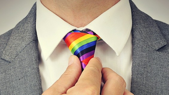 businessman with a rainbow necktie, with a slight vignette added