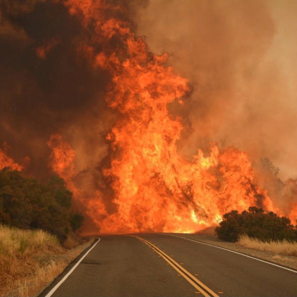 Bright flames seen on a road in Mariposa County, California, U.S. in this picture obtained from social media.
