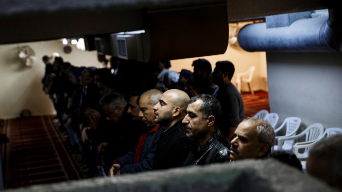 Muslims living in Greece attend Friday prayers at the Masjid Al-Salam makeshift mosque in Athens