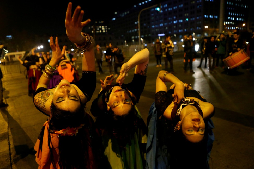 Pro-abortion activists perform a dance during a rally held to support women's rights to an abortion in Santiago,