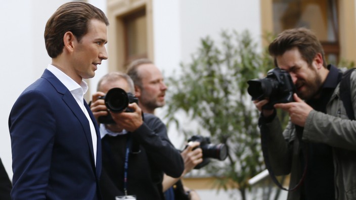 Austria's Foreign Minister and designated new leader of the OeVP Kurz leaves  a news conference in Vienna
