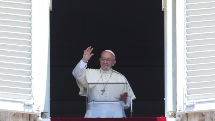 Pope Francis waves as he leads Sunday Angelus prayer in Saint Peter's square at the Vatican