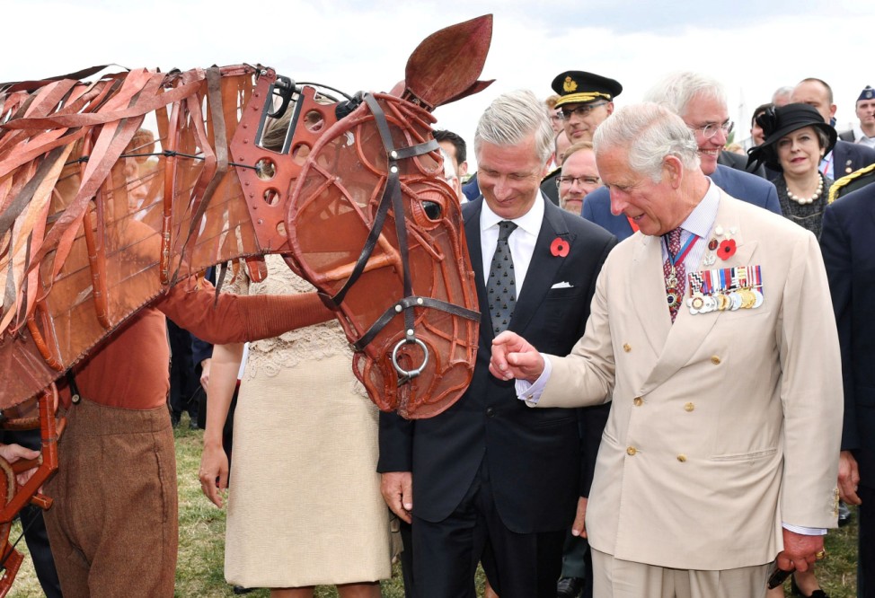 King Philippe of Belgium and Britain's Prince Charles stand next to the pupprt from War Horse during  commemorations to mark the centenary of Passchendaele, The Third Battle of Ypres, in Belgium