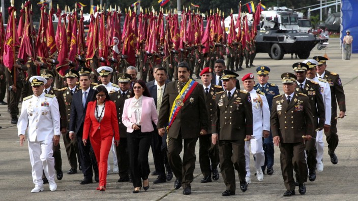Venezuela's President Nicolas Maduro arrives for a military parade to celebrate the 80th anniversary of the Venezuela's National Guard, in Caracas