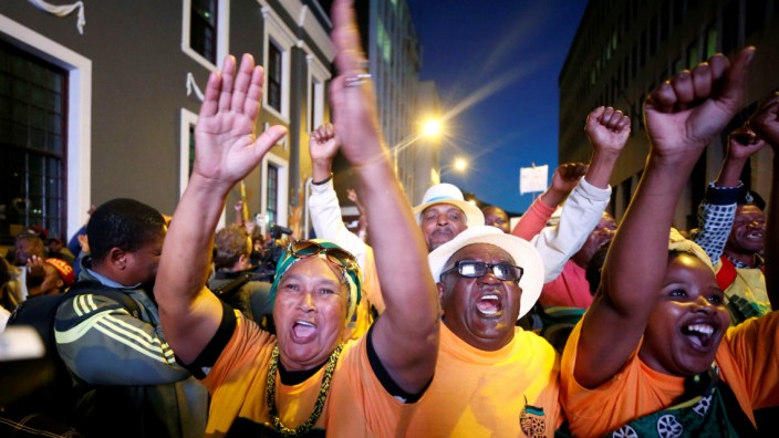 Pro-Zuma supporters celebrate after the vote of no confidence against President Jacob Zuma failed in Cape Town, South Africa