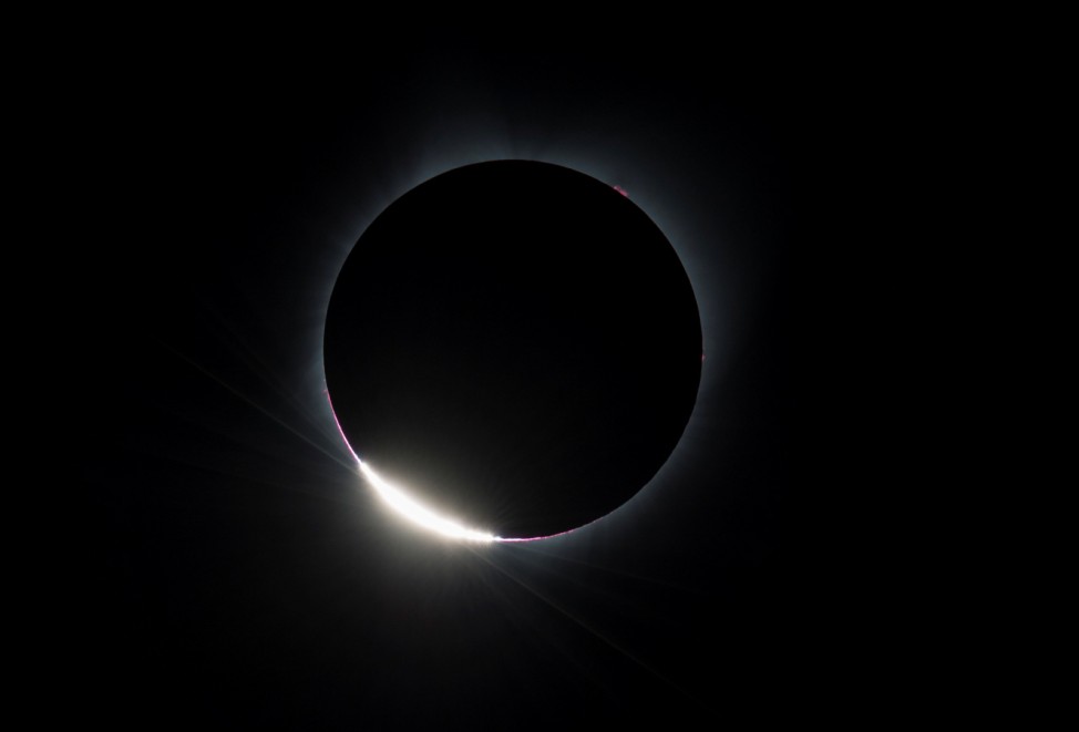 The Diamond Ring effect is seen as the moon makes its final move over the sun during the total solar eclipse above Madras