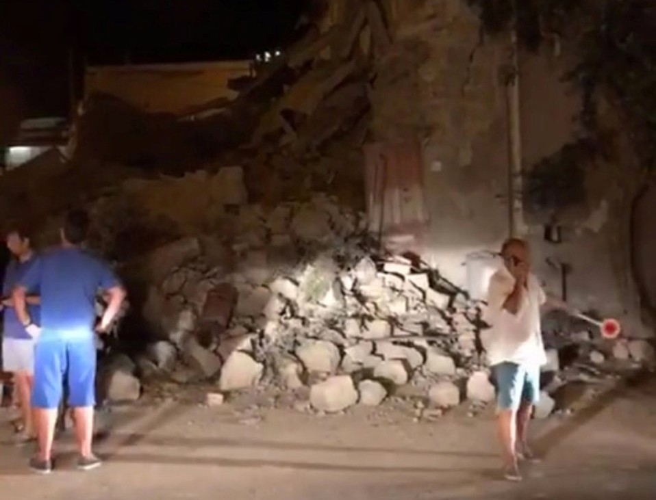 People view damage after an earthquake hit the island of Ischia