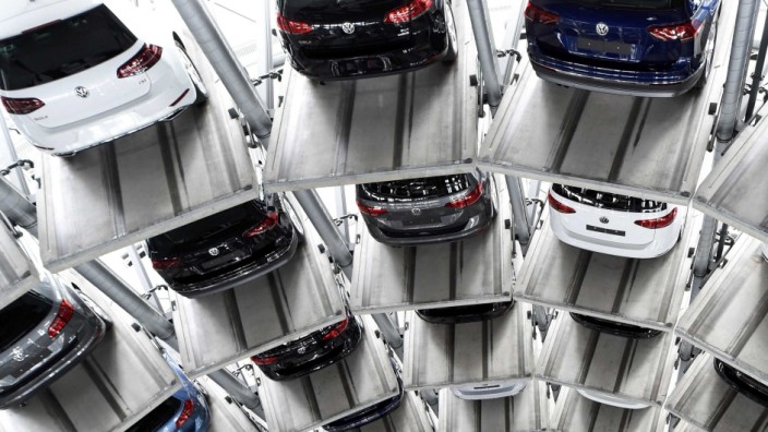 VW cars are loaded in a delivery tower at the plant of German carmaker Volkswagen in Wolfsburg
