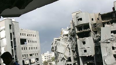 Krieg im Gaza-Streifen: Zerstörte Häuser in Gaza-Stadt: "Es gibt keine Waffenruhe", sagte Israels Innenminister Meir Schitrit.