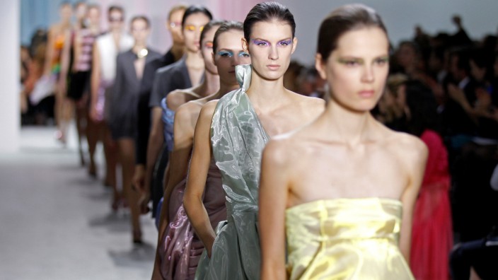 FILE PHOTO: Models present creations by Belgian designer Raf Simons as part of his Spring/Summer 2013 women's ready-to-wear fashion show for French house Dior during Paris fashion week