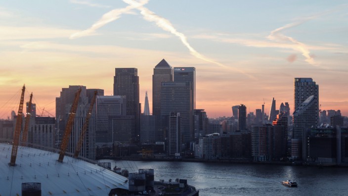 FILE PHOTO: Canary Wharf and the City at sunset in London