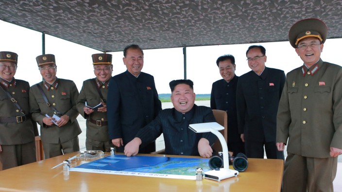 North Korean leader Kim Jong Un inspects a long and medium-range ballistic rocket launch drill