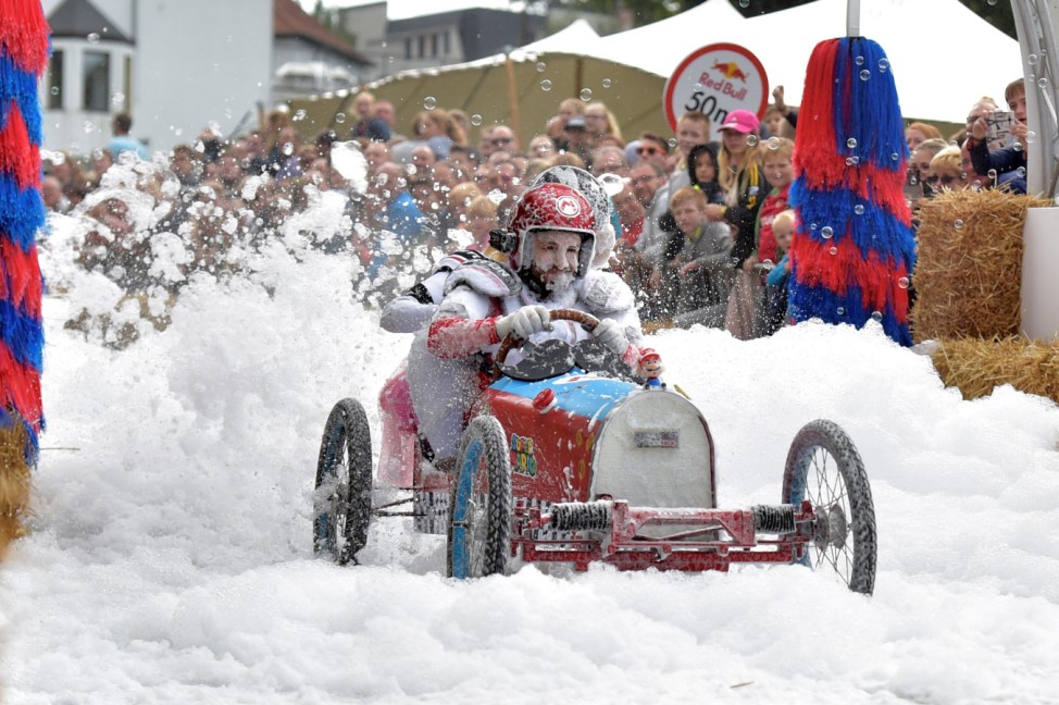 Competitors drive their homemade vehicle without an engine during the Red Bull Soapbox Race in Kluisbergen