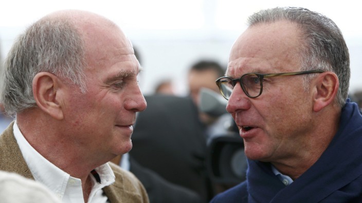Former Bayern Munich President Hoeness speaks to Rummenigge, CEO of Bayern Munich during official foundation stone laying ceremony of Bayern Munich's youth training centre in Munich
