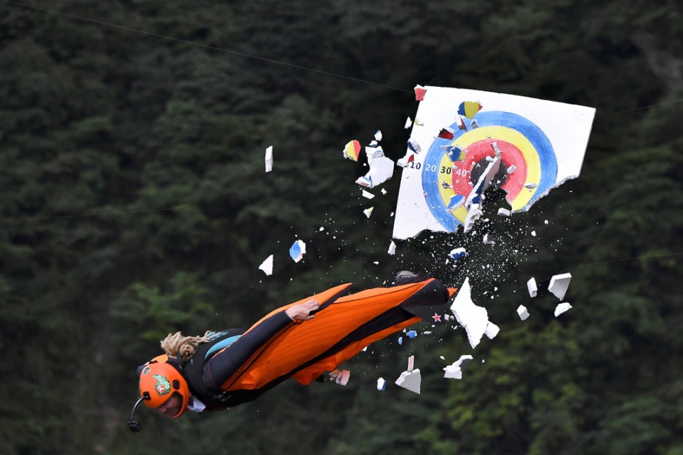 A wingsuit flyer hits the target during Wingsuit Flying World Championship in Zhangjiajie