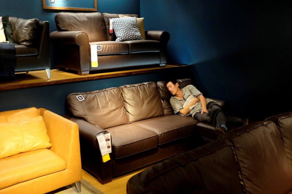 A customer takes a nap at an IKEA store in Beijing, China