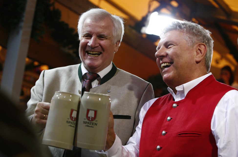 Bavarian state Premier Seehofer and Munich mayor Reiter pose during the opening ceremony of the 184th Oktoberfest in Munich