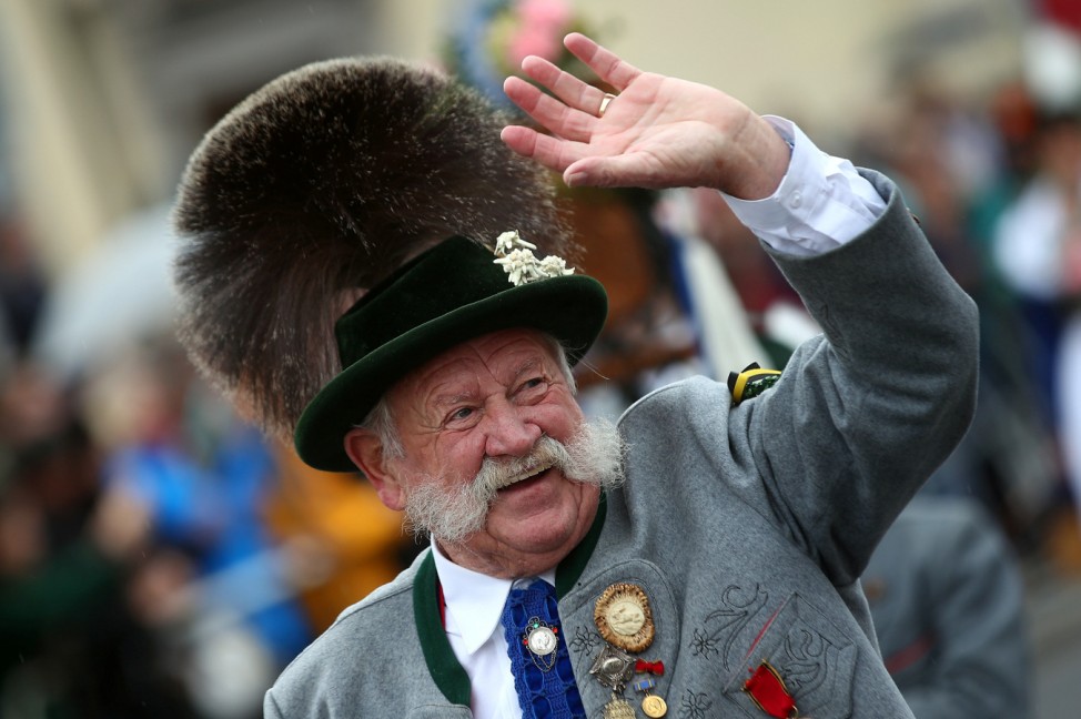 A man dressed in traditional Bavarian clothes takes part in the Oktoberfest parade in Munich