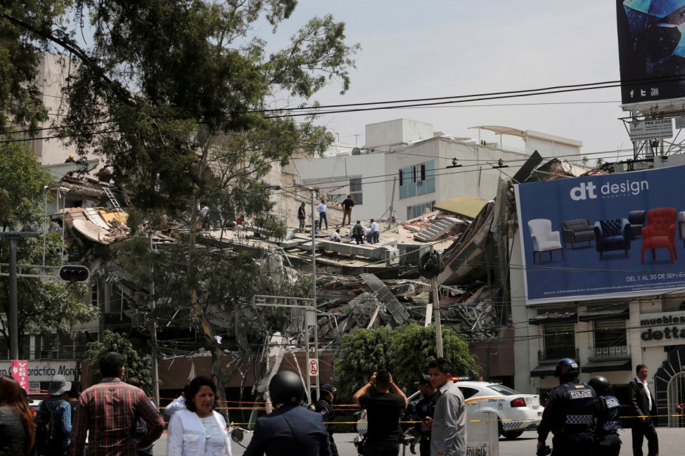 A collapsed building is seen after an earthquake in Mexico City