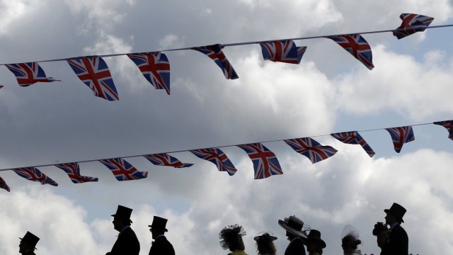Racegoers arrive for the first day of racing at Royal Ascot in southern England